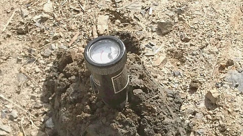 掘り出した土の含水量を測定